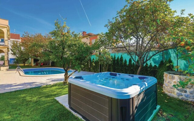 Awesome Home in Kastel Stafilic with Hot Tub, WiFi & 4 Bedrooms