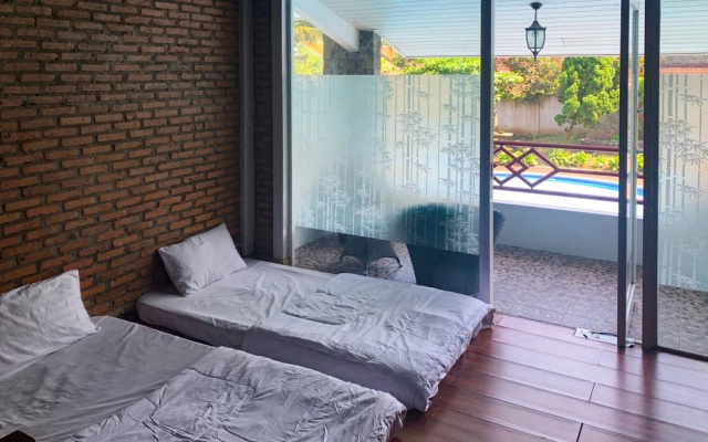 Urbanview Hotel Villa Q Gisting by RedDoorz – Guest Rooms – Campang