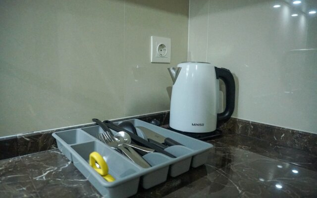 Strategic Location 1BR Apartment @ Puri Mansion near Puri By Travelio