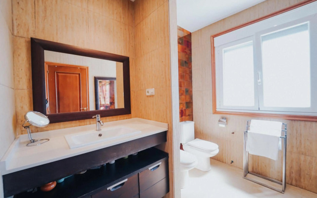 Villa con piscina a pie de playa