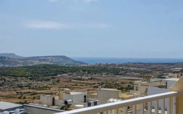 Summer Breeze Penthouse with large Terrace and Hot Tub by Getaways Malta