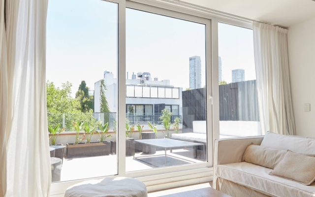 Unique triplex with rooftop private use