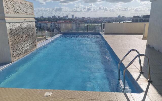 A Lovely 3-Bedroom Apartment with a Rooftop Pool