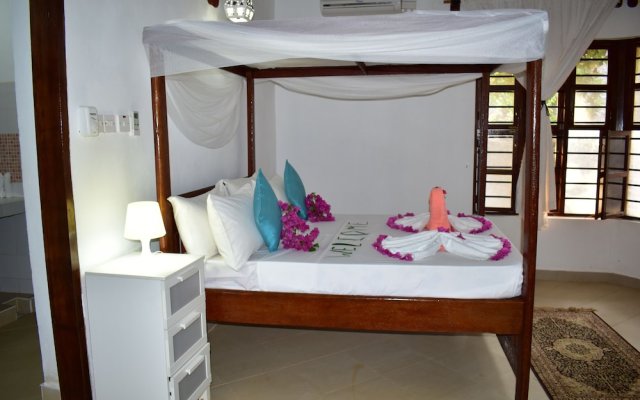 "room in Guest Room - Romantic Room With Access to Beach Ideal for 2 Guests, in Kigomani, Zanzibar"