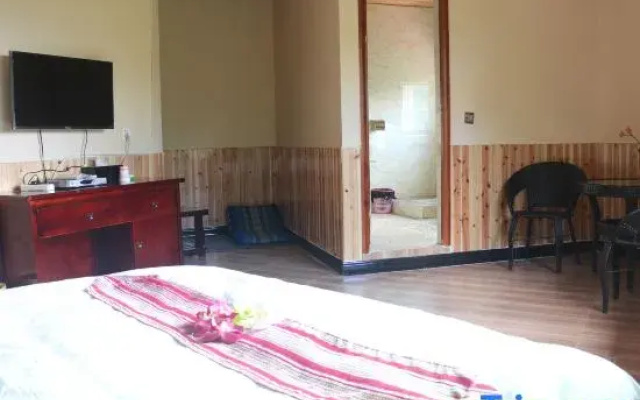 Mengla Bajiaolou Inn