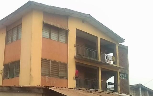 A 2-story building with 2 shops