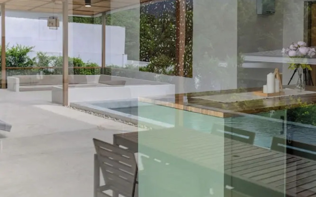 Tropical Poolside Retreat by Sea N' Rent