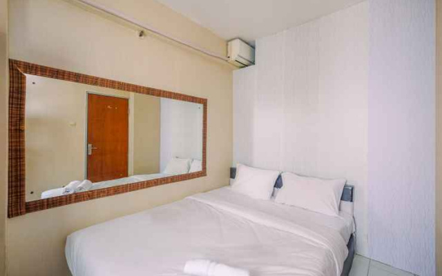 Compact and Homey 2BR Cibubur Village Apartment By Travelio