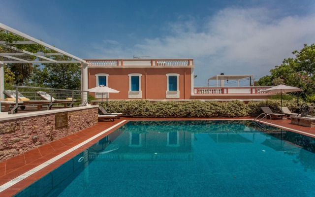 Dine on the Generous Veranda at a Rustic Stone Getaway