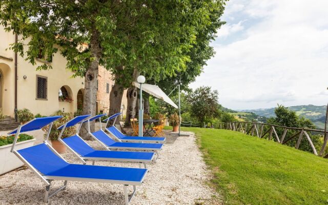 House on the Property Next to an Ancient Villa With a View of the Hills and Pool