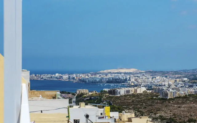 Summer Breeze Penthouse with large Terrace and Hot Tub by Getaways Malta