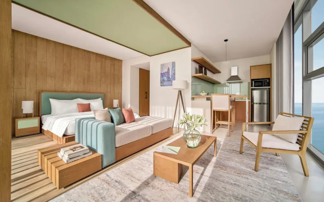 Signature By M Village Beachfront Hotel