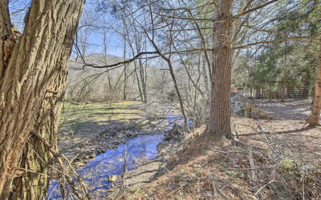 Quaint Creekside Home w/ Spacious Deck & Yard