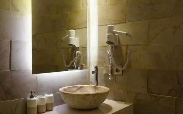 Studio Room at Cosmy Orchard Apartment