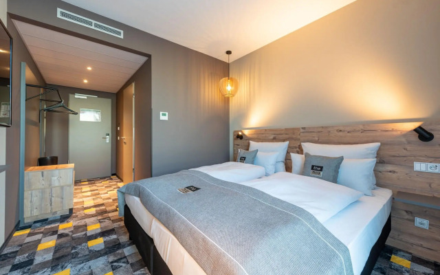 Отель Holiday Inn - the niu, Timber Esslingen, an IHG Hotel