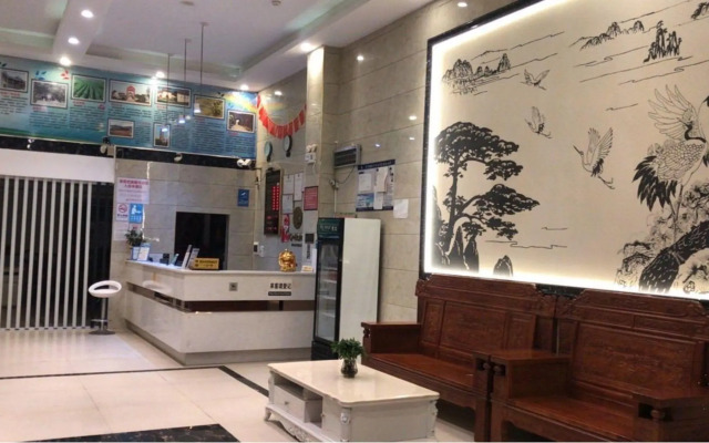 Q+ Nanxiong Xinhewan Business Hotel