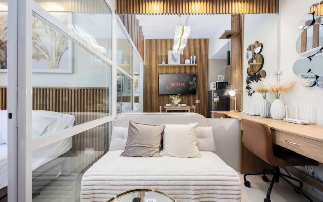 Elegant Wood-accent Studio With Balcony