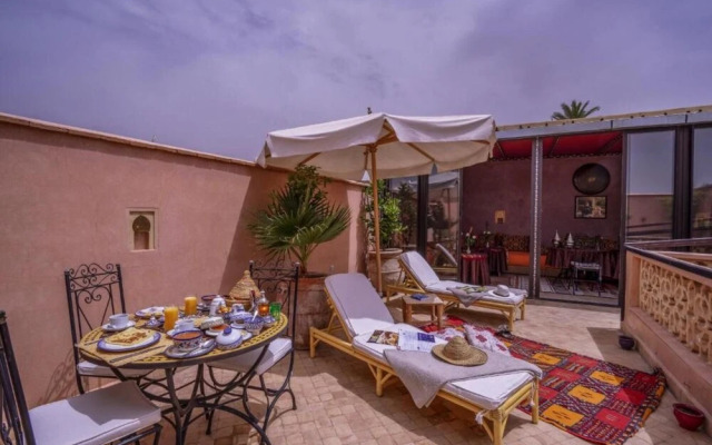 "room in Guest Room - Riad Lakouas Triple Room With Pool View"