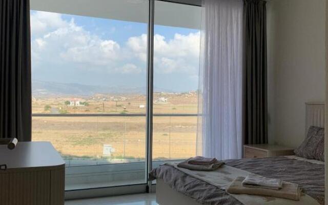 Stunning 2 plus 1 apartment for rent in ABELIA RESIDENCE at Bogaz with beautiful sea and mountains views