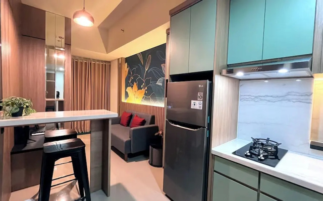 Warm And Homey 2Br At Vida View Makassar Apartment
