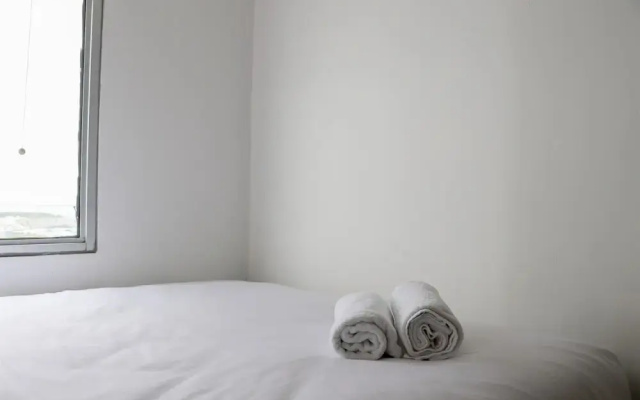 Warm And Minimalist 2Br Green Bay Pluit Apartment
