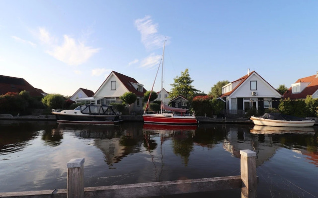 Nice Holiday Home on the Water in Grou