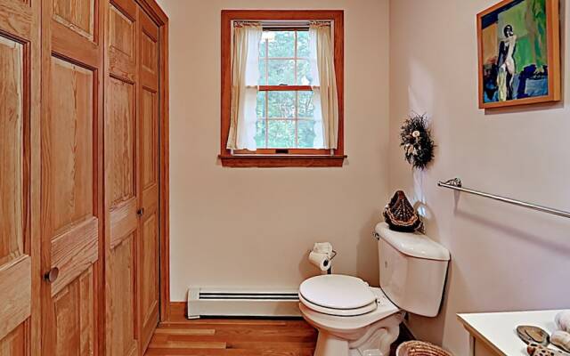 Woodsy Cape Cod Home by RedAwning