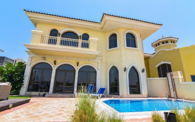 Beautiful Palm Villa with Private Beach & Pool