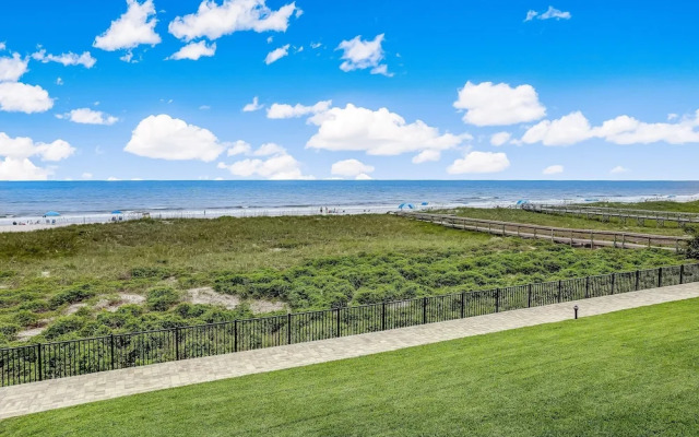 Oceanfront Beach Condo with Private Balcony, Short Walk to Pool and Beach by RedAwning