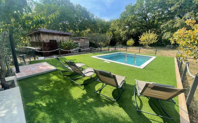 Vacation home with private swimming pool surrounded by nature