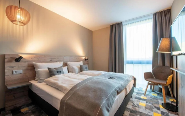 Отель Holiday Inn - the niu, Timber Esslingen, an IHG Hotel