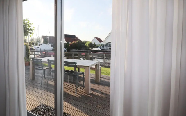 Nice Holiday Home on the Water in Grou