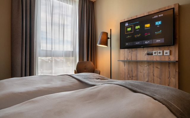 Отель Holiday Inn - the niu, Timber Esslingen, an IHG Hotel