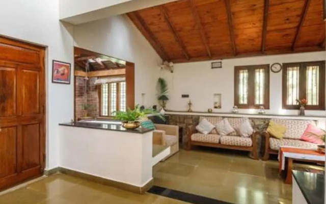 Kerala Style Villa by Stayjade | AC | 4bhk | fishpond