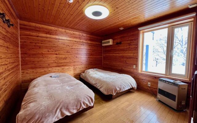 Yellow House by Lake Toya