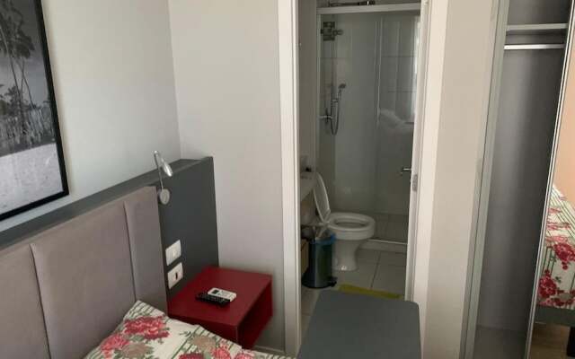 Quarto e Sala Particular em Aparthotel