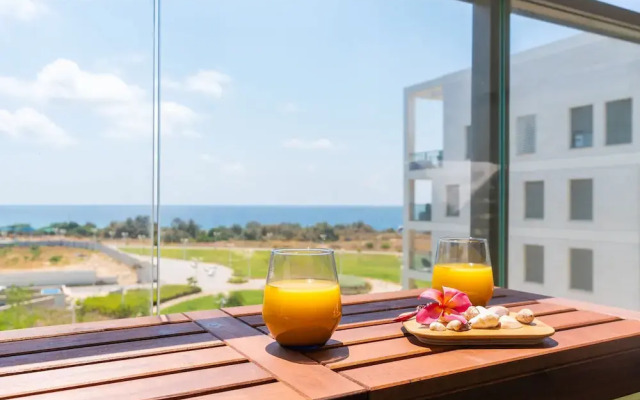 Vibrant Seaside Stay with Balcony by Sea N' Rent