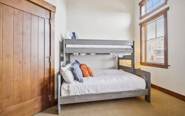 Expansive 4 Bedroom Ski in, Ski out One Ski Hill Residence Located at the Base of Peak 8 with Beautiful Views