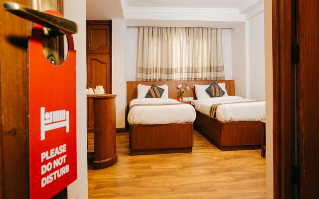 Osho Holiday Inn by OYO Rooms