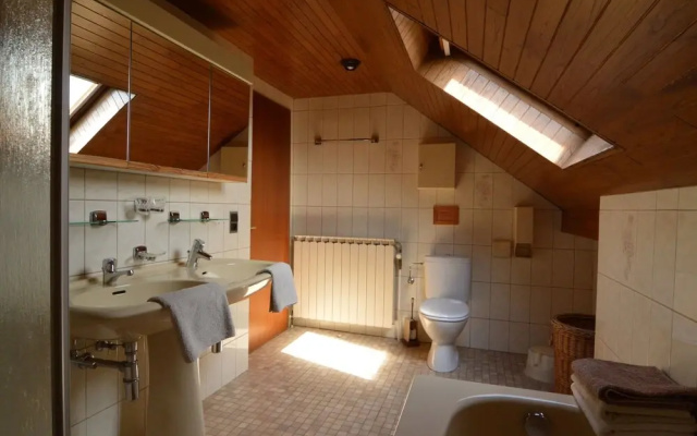 House With Beautiful Wooden Balcony Located Against the Hills