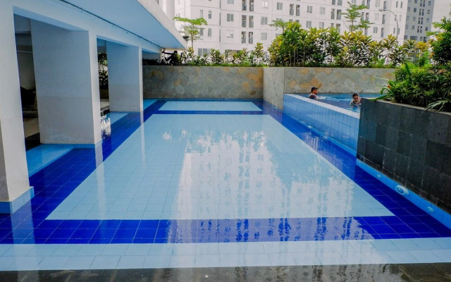 2BR Minimalist Bassura City Apartment By Travelio