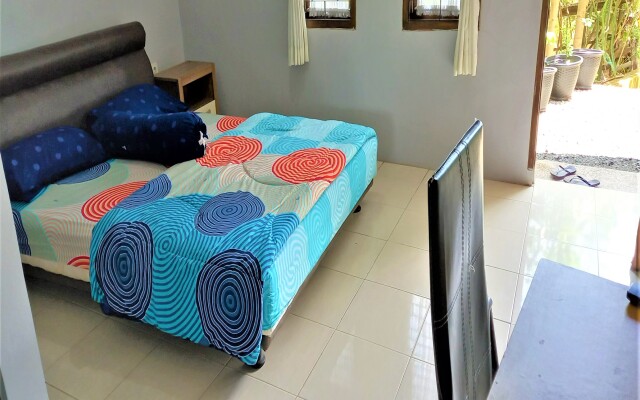 Nabila Syar i Guesthouse by ZUZU