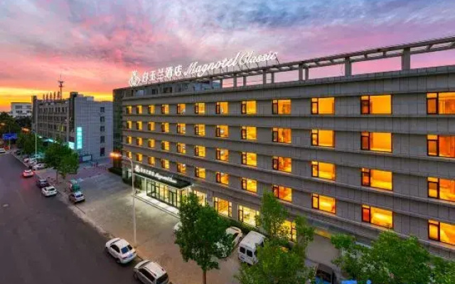 Magnolia Business Hotel ( Dalian Jinzhou Hengda Garden）