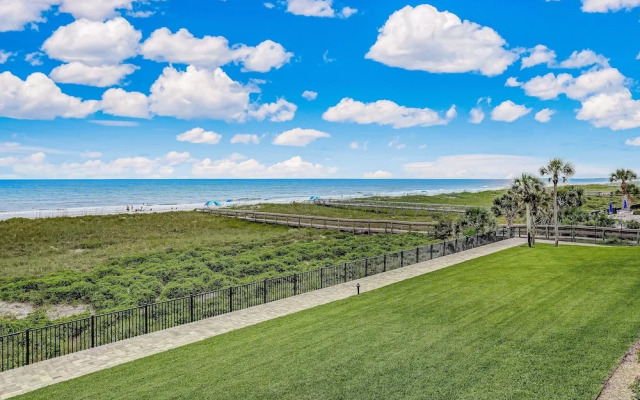 Oceanfront Beach Condo with Private Balcony, Short Walk to Pool and Beach by RedAwning