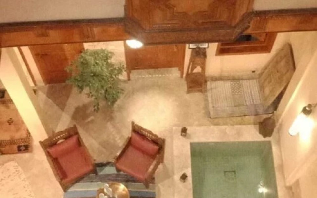 "room in Guest Room - Riad Lakouas Triple Room With Pool View"