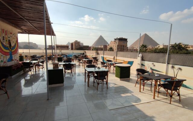 Nefertiti Pyramids View