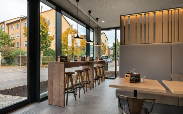 Отель Holiday Inn - the niu, Timber Esslingen, an IHG Hotel