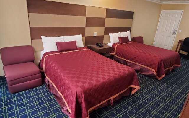 Delmonico Inn & Suites