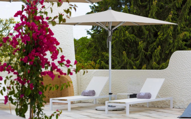 Ozadi Tavira Hotel