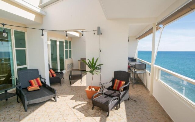 Beachfront Penthouse with Ocean and Sunset Views at Pelican Reef #703